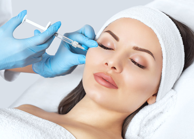 The doctor cosmetologist makes the Rejuvenating facial injection